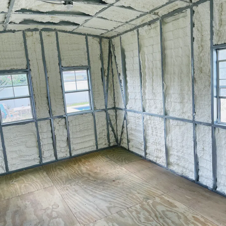 Closed-cell spray foam insulation applied to wall cavities in a residential project in Adel
